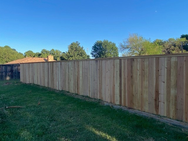 Cap and trim cedar privacy fence side view