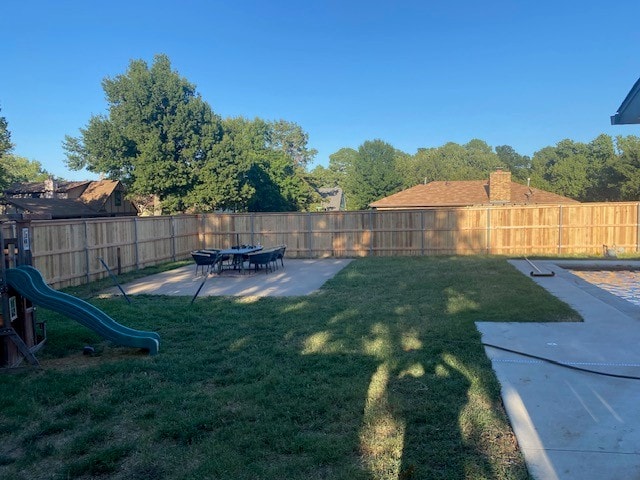 Completed cap and trim privacy fence backyard view